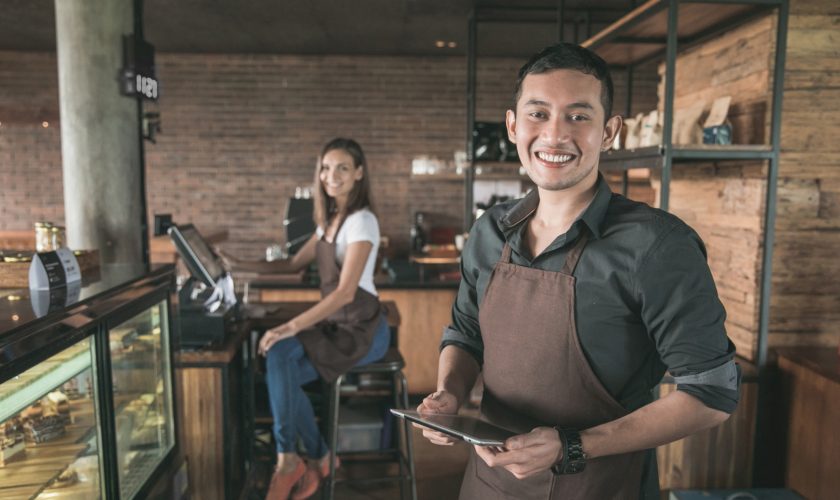 cafe owner using tablet pc