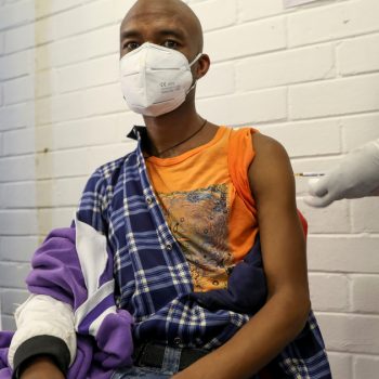 A volunteer receives an injection from a medical worker during the country’s first human clinical trial for a potential vaccine against the novel coronavirus, in Soweto